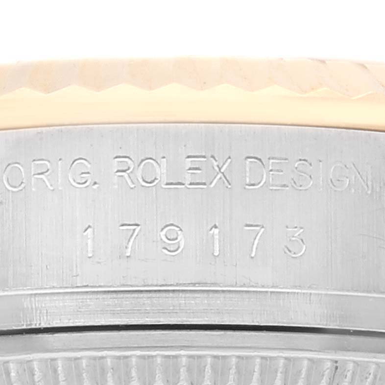 This image shows a close-up view of the engraved reference number and part of the bezel of the Rolex Datejust 179173 Women's Steel and Gold (two tone) Silver Dial 179173 Women's Steel and Gold (two tone) Silver Dial watch.
