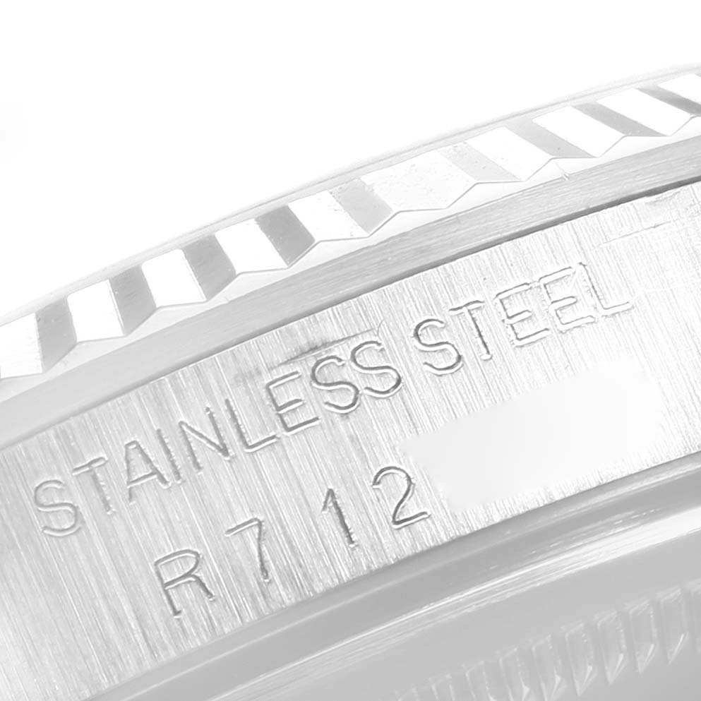 The image shows a close-up of the stainless steel fluted bezel and rehaut with engravings on a Rolex Datejust 16234 Men
s Stainless Steel Black Dial 16234 Men
s Stainless Steel Black Dial watch.