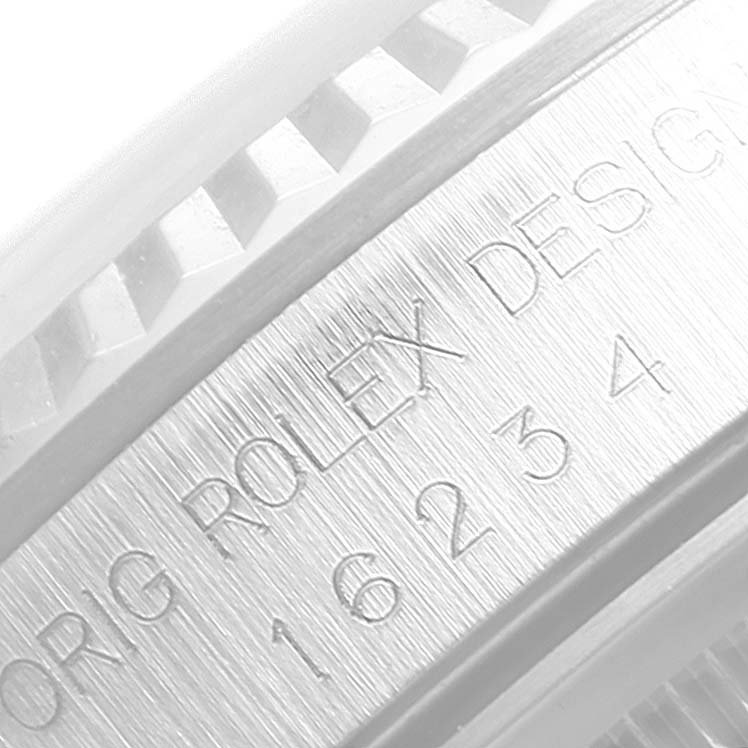 This image shows a close-up view of the bezel and part of the case of a Rolex Datejust 16234 Men
s Stainless Steel Pink Dial 16234 Men
s Stainless Steel Pink Dial watch.