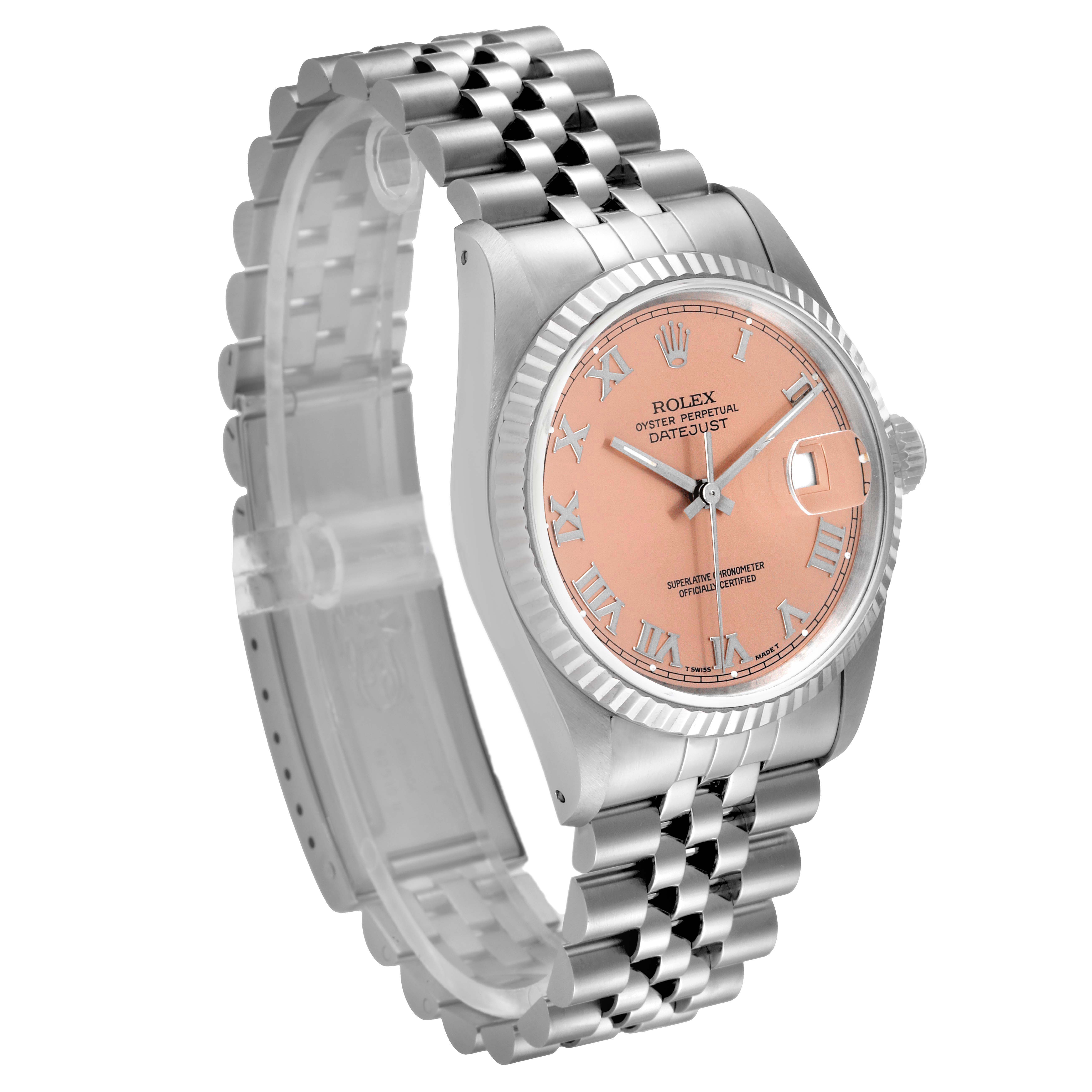 The image shows a Rolex Datejust 16234 Men
s Stainless Steel Pink Dial 16234 Men
s Stainless Steel Pink Dial watch at an angled view, highlighting the bracelet, case, and pink dial with Roman numerals.