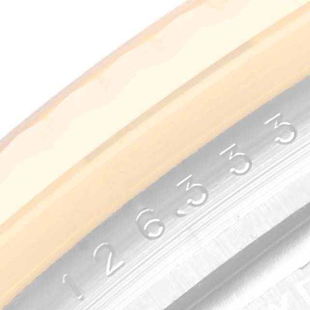 This image shows a close-up angle of the bezel and the edge of the dial of a Rolex Datejust 41 M126333-0012 Men's Steel and Gold (two tone) Black Dial M126333-0012 Men's Steel and Gold (two tone) Black Dial model.