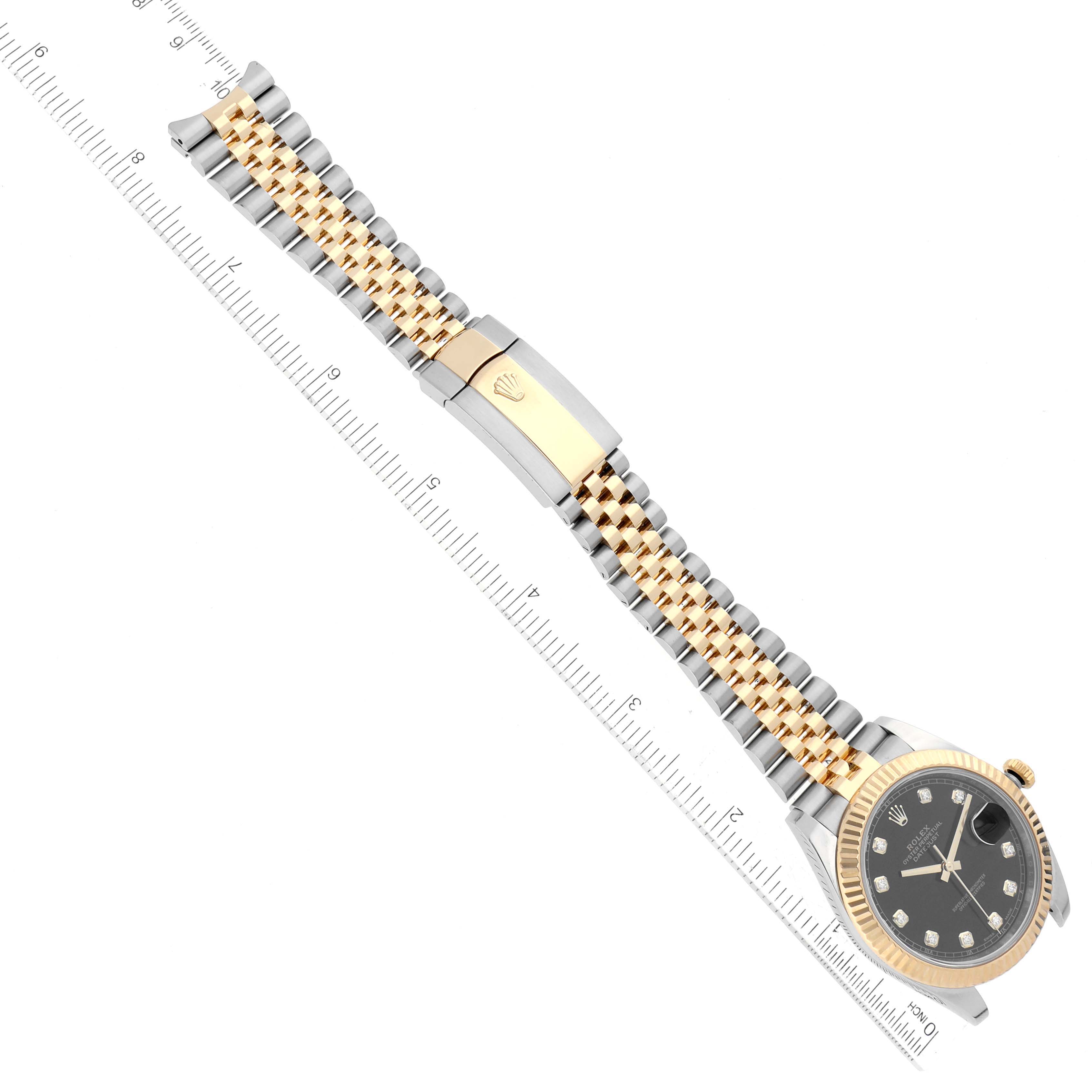 This image shows a top-down view of a Rolex Datejust 41 M126333-0012 Men's Steel and Gold (two tone) Black Dial M126333-0012 Men's Steel and Gold (two tone) Black Dial watch, highlighting its two-tone bracelet and clasp.
