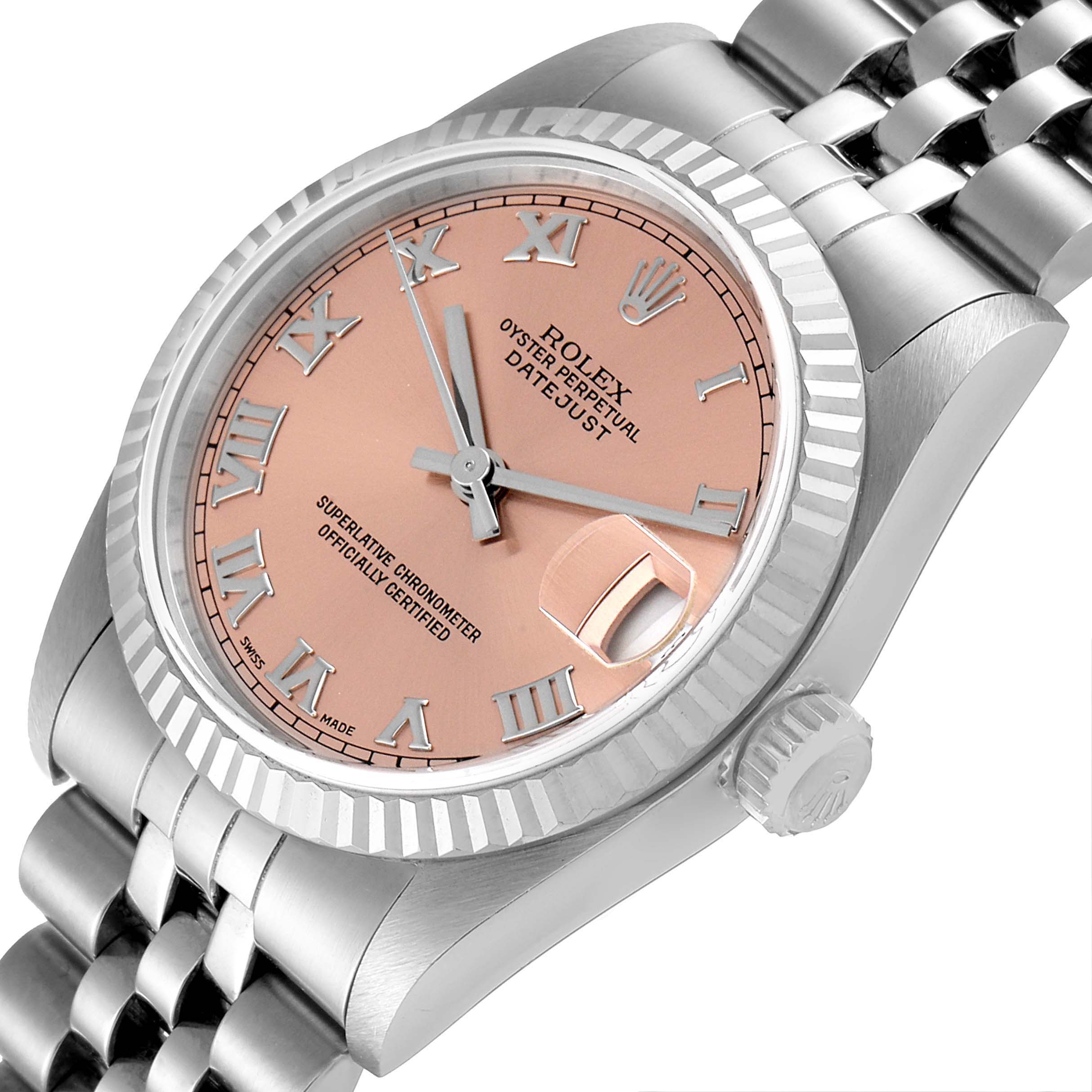 This image shows a Rolex Mid-Size 68274 Women
s Stainless Steel Pink Dial 68274 Women
s Stainless Steel Pink Dial Oyster Perpetual Datejust watch at an angled view, highlighting the face, bezel, crown, and partial bracelet.