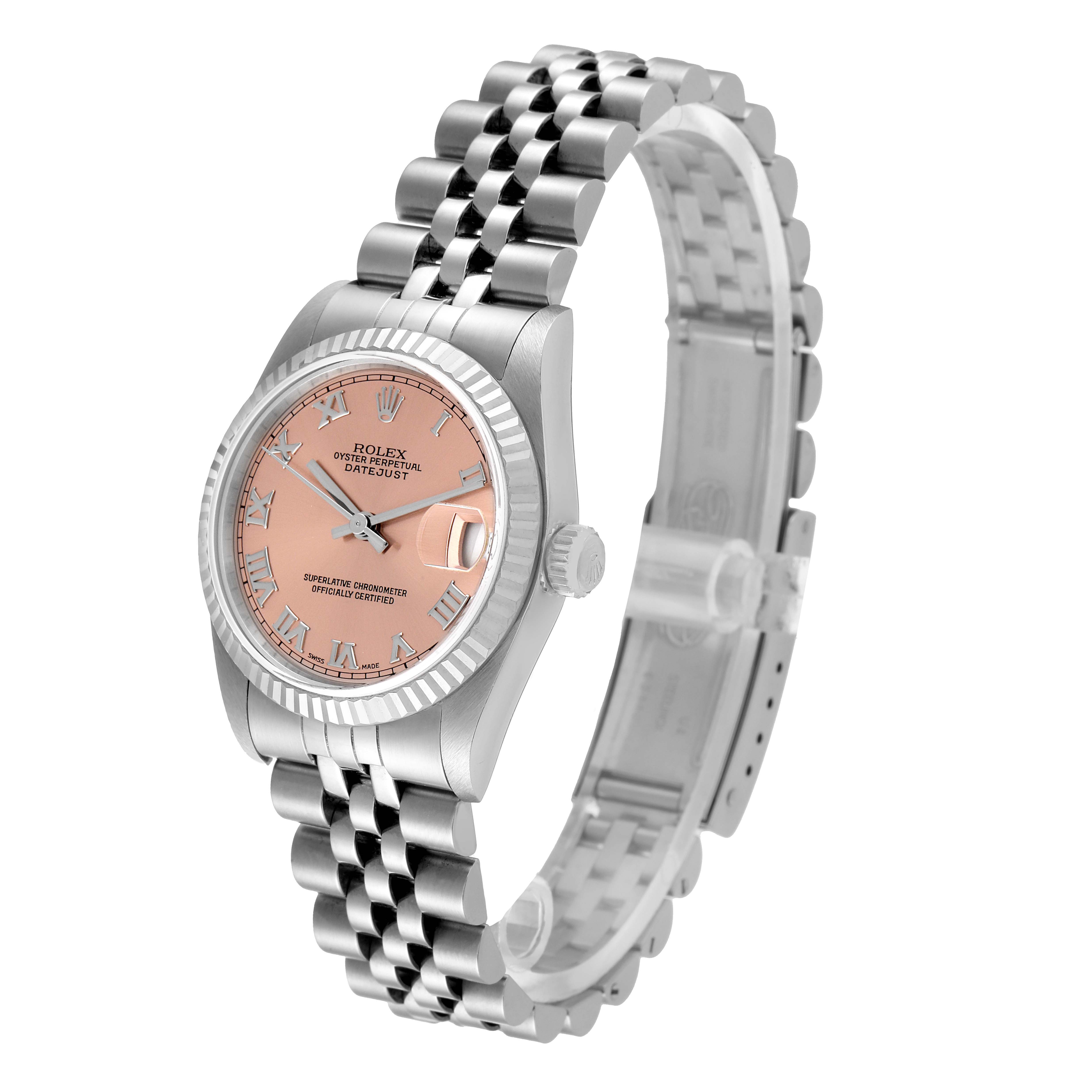 The Rolex Mid-Size 68274 Women
s Stainless Steel Pink Dial 68274 Women
s Stainless Steel Pink Dial watch is shown at a three-quarter angle, highlighting its pink dial, bracelet, and fluted bezel.