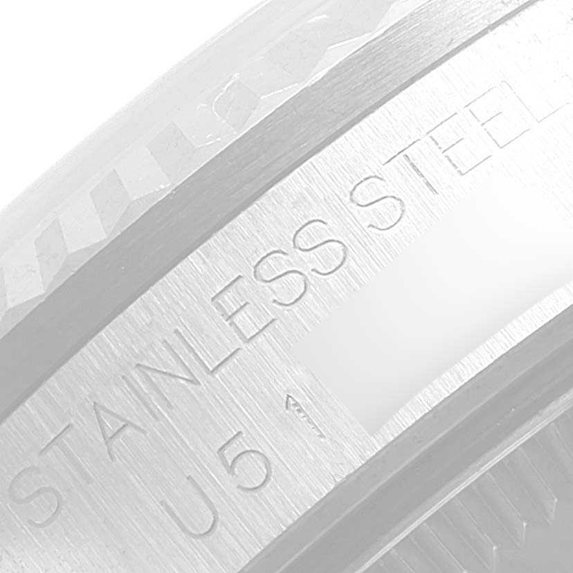 The image shows a close-up of the stainless steel casing with engravings on a Rolex Mid-Size 68274 Women
s Stainless Steel Pink Dial 68274 Women
s Stainless Steel Pink Dial watch.