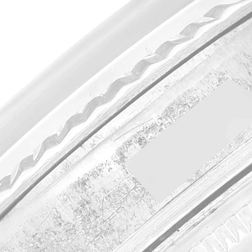 This close-up image of the Rolex Vintage Collection 1601 Men's Stainless Steel Silver Dial 1601 Men's Stainless Steel Silver Dial watch showcases a detailed view of the watch's bezel.