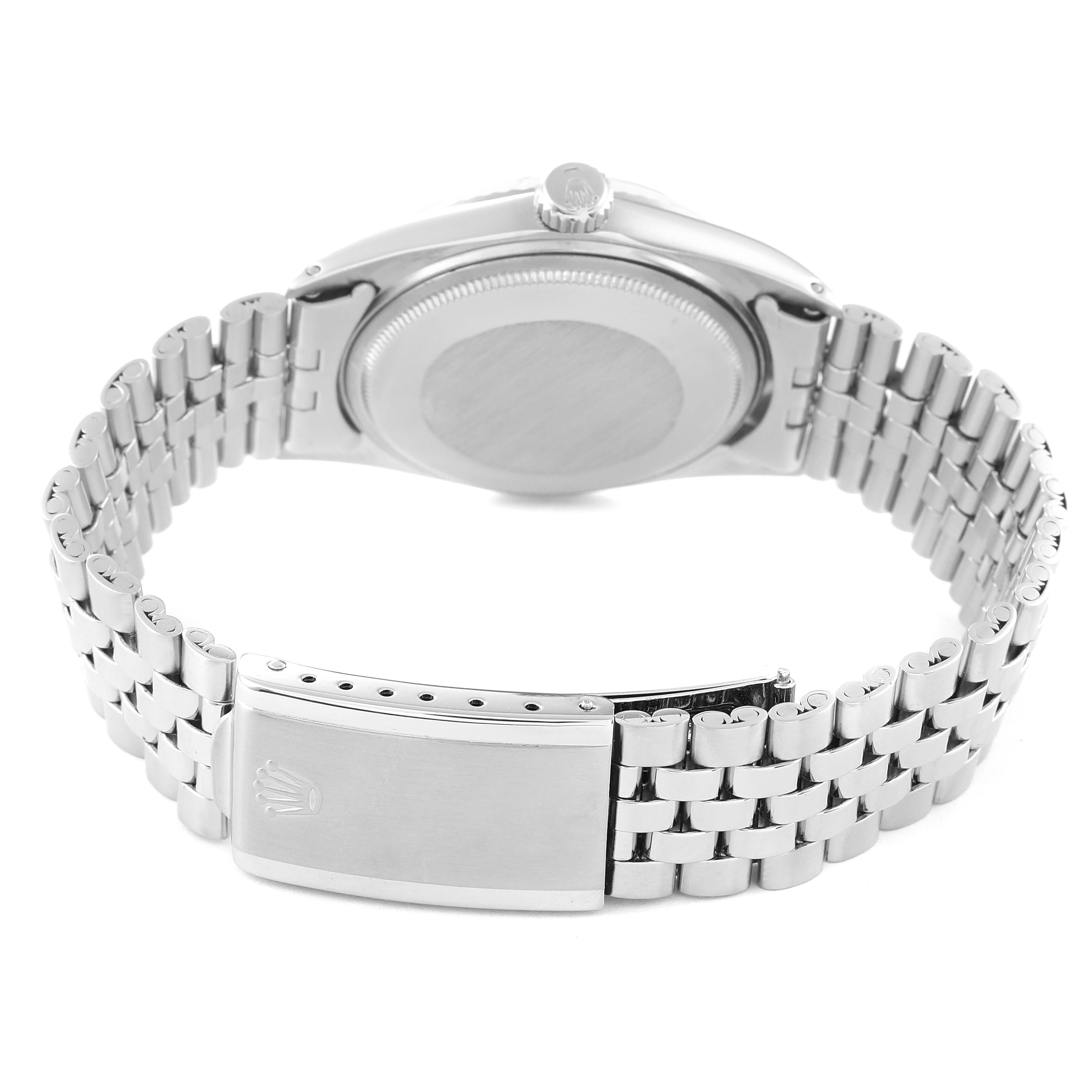 The watch is a Rolex Vintage Collection 1601 Men's Stainless Steel Silver Dial 1601 Men's Stainless Steel Silver Dial model, shown from the back with a view of its linked bracelet and closed clasp.