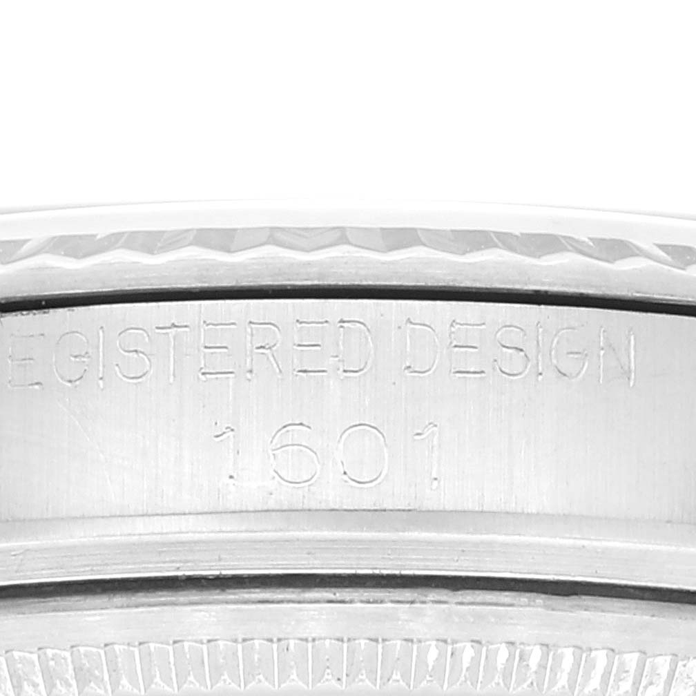 This close-up image shows the engraved "REGISTERED DESIGN 1601" on the caseback edge of the Rolex Vintage Collection 1601 Men's Stainless Steel Silver Dial 1601 Men's Stainless Steel Silver Dial watch.