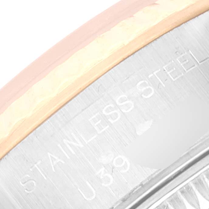 The image shows a close-up of the side of the bezel and case of a Rolex Datejust 69173 Women's Steel and Gold (two tone) Champagne Dial 69173 Women's Steel and Gold (two tone) Champagne Dial watch, highlighting "Stainless Steel" engraving.