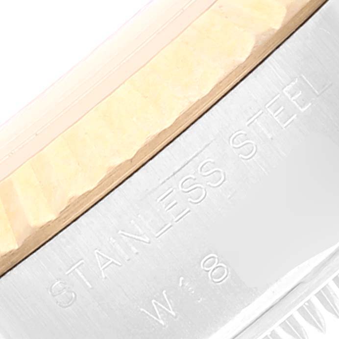 The image shows a close-up of the stainless steel body and fluted bezel of a Rolex Datejust 69173 Women's Steel and Gold (two tone) Champagne Dial 69173 Women's Steel and Gold (two tone) Champagne Dial watch.