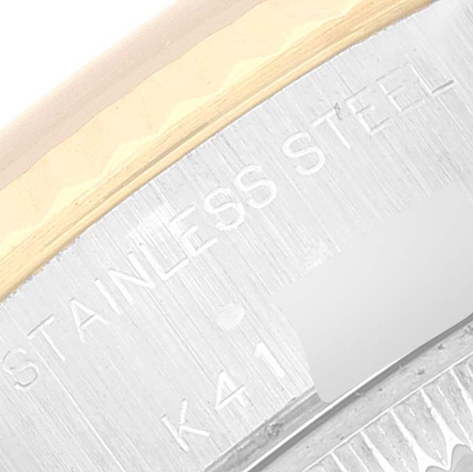 This is a close-up of the side engraving on the stainless steel bezel of a Rolex Datejust 79173 Women's Steel and Gold (two tone) Silver Dial 79173 Women's Steel and Gold (two tone) Silver Dial watch.