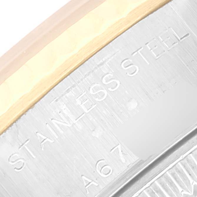 This image shows a close-up of the stainless steel and gold parts of a Rolex Datejust 79173 Women's Steel and Gold (two tone) Grey Dial 79173 Women's Steel and Gold (two tone) Grey Dial watch case.