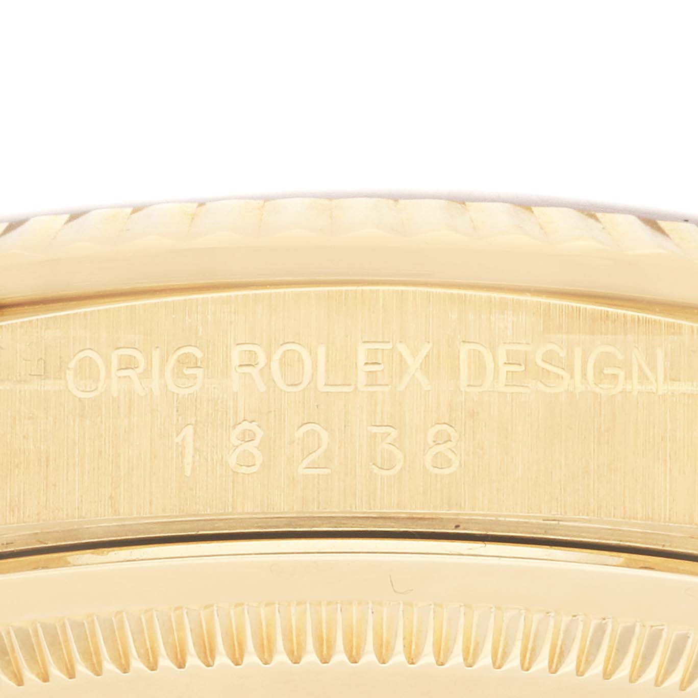 This close-up image shows the engraved model number on the side of the Rolex President 18238 Men
s Yellow Gold Champagne Dial 18238 Men
s Yellow Gold Champagne Dial watch case.