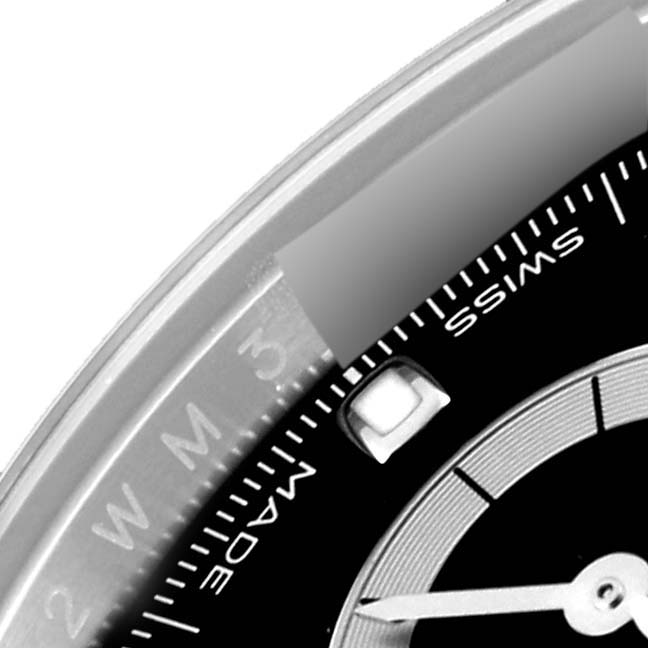 This close-up image of a Rolex Daytona 116500LN Men's Stainless Steel Black Dial 116500LN Men's Stainless Steel Black Dial watch shows part of the black dial with "SWISS" text and a bit of the bezel.