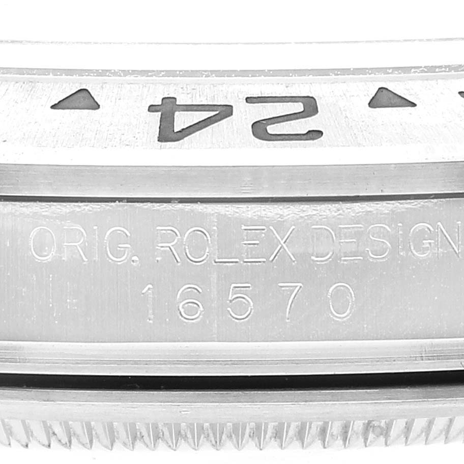 Close-up of the side of a Rolex Explorer 16570 Men
s Stainless Steel White Dial 16570 Men
s Stainless Steel White Dial watch, showing the model number 16570 and the "ORIG. ROLEX DESIGN" engraving.