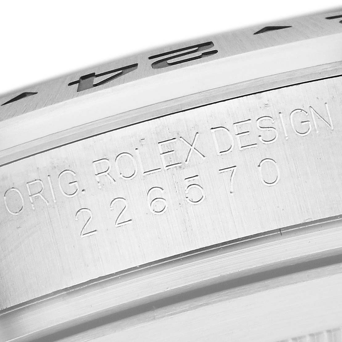 This image shows a close-up of the side of the case with engravings on a Rolex Explorer 226570 Men's Stainless Steel White Dial 226570 Men's Stainless Steel White Dial model watch.