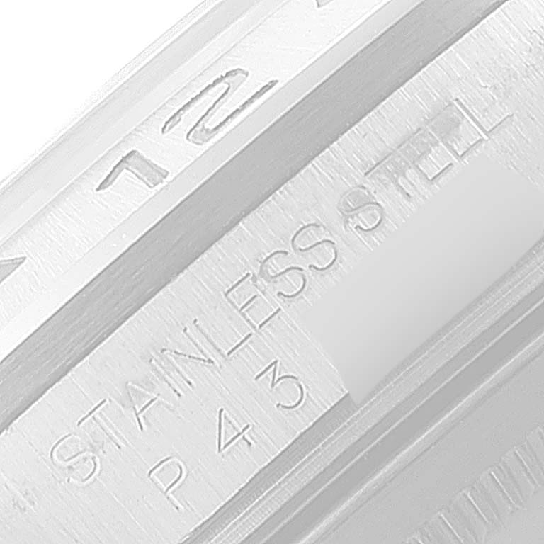 This close-up image shows the engraved text on the stainless steel bezel of a Rolex Explorer 16570 Men
s Stainless Steel Black Dial 16570 Men
s Stainless Steel Black Dial watch.