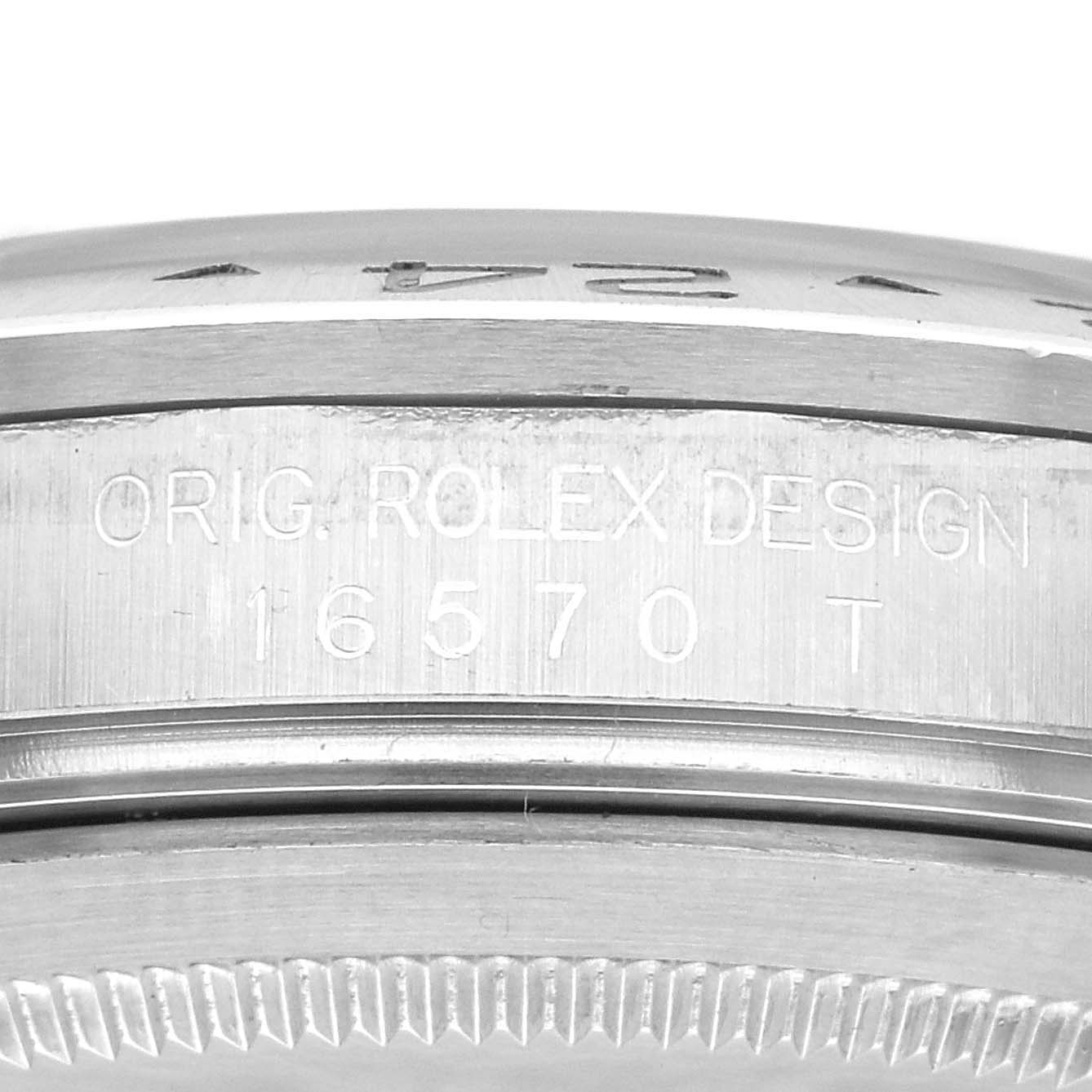 The image shows a close-up view of the case side, engraving "ORIG. ROLEX DESIGN 16570 T" on the Rolex Explorer 16570 Men
s Stainless Steel Black Dial 16570 Men
s Stainless Steel Black Dial model.