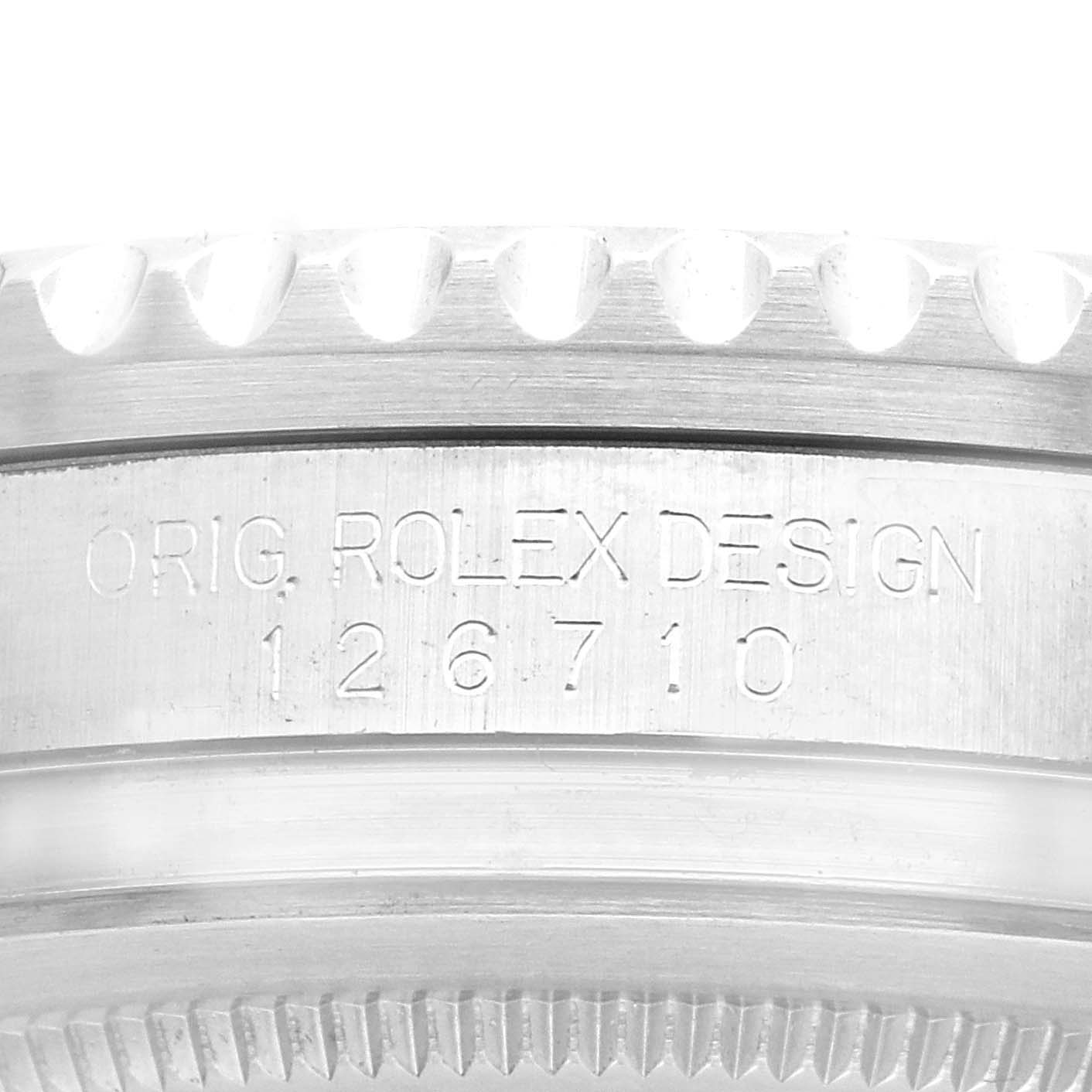 This image shows the side engraving and bezel of a Rolex GMT-Master 126710BLNR Men
s Stainless Steel Black Dial 126710BLNR Men
s Stainless Steel Black Dial, displaying "ORIG. ROLEX DESIGN 126710."