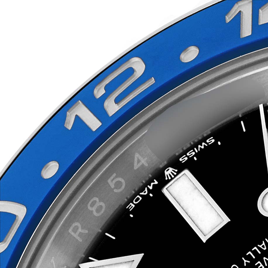 This close-up shows the upper part of the bezel and part of the dial of a Rolex GMT-Master 126710BLNR Men
s Stainless Steel Black Dial 126710BLNR Men
s Stainless Steel Black Dial watch.