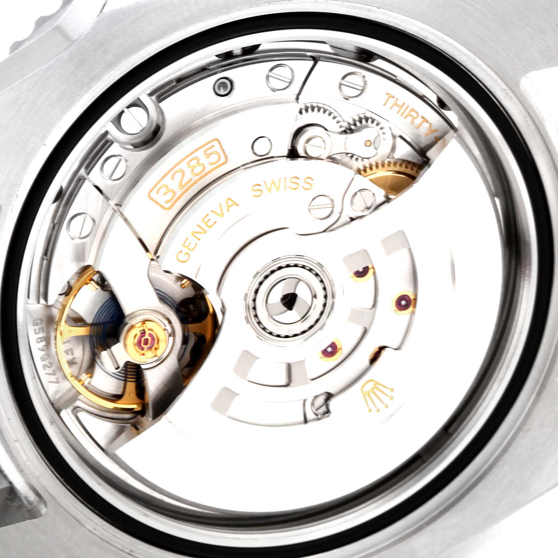 The image shows the inner movement and mechanism of a Rolex GMT-Master 126710 Men's Stainless Steel Black Dial 126710 Men's Stainless Steel Black Dial watch, including gears and inscriptions.