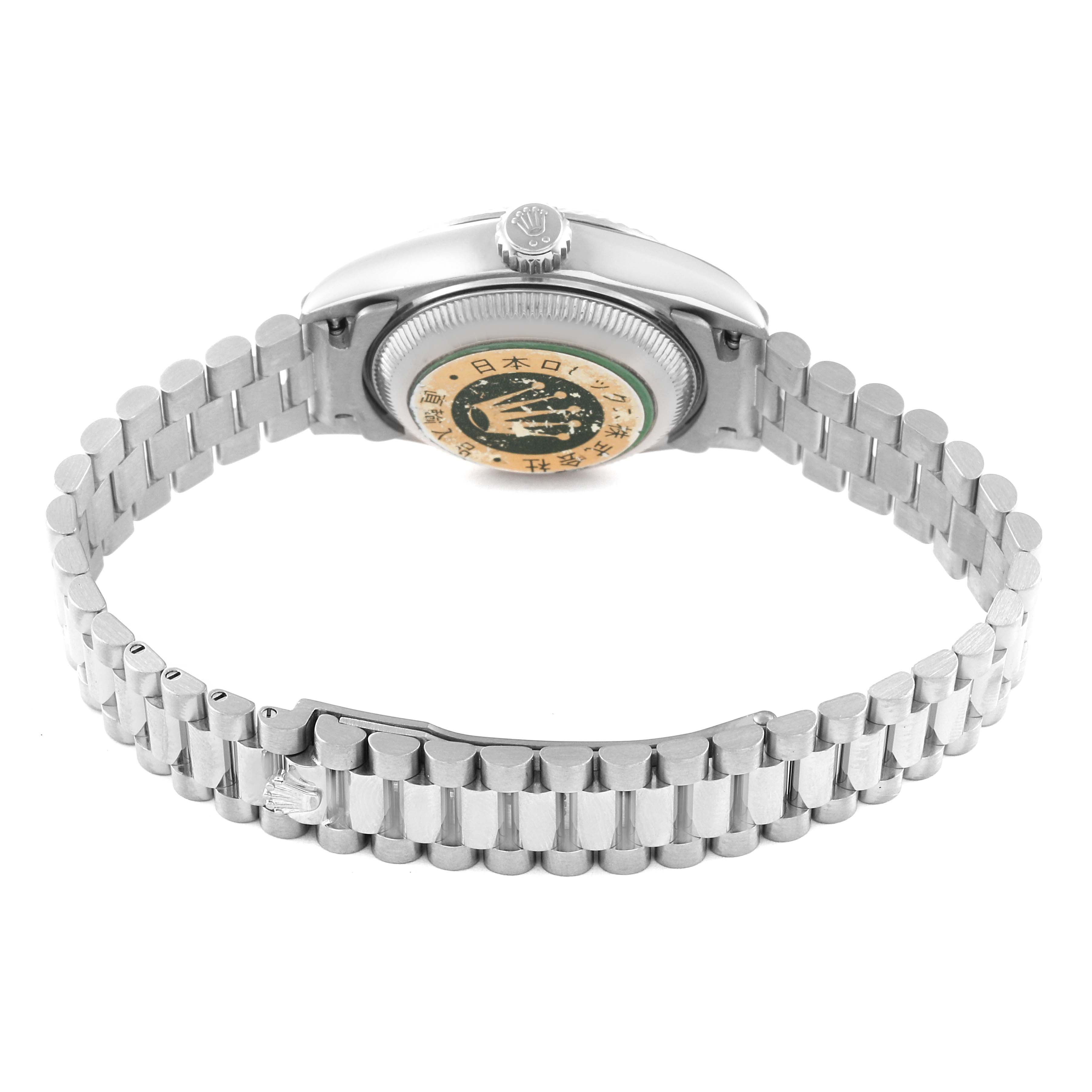This image shows the back and bracelet of a Rolex President 69179 Women's White Gold Silver Dial 69179 Women's White Gold Silver Dial model watch, displaying the case back and logo-engraved clasp.