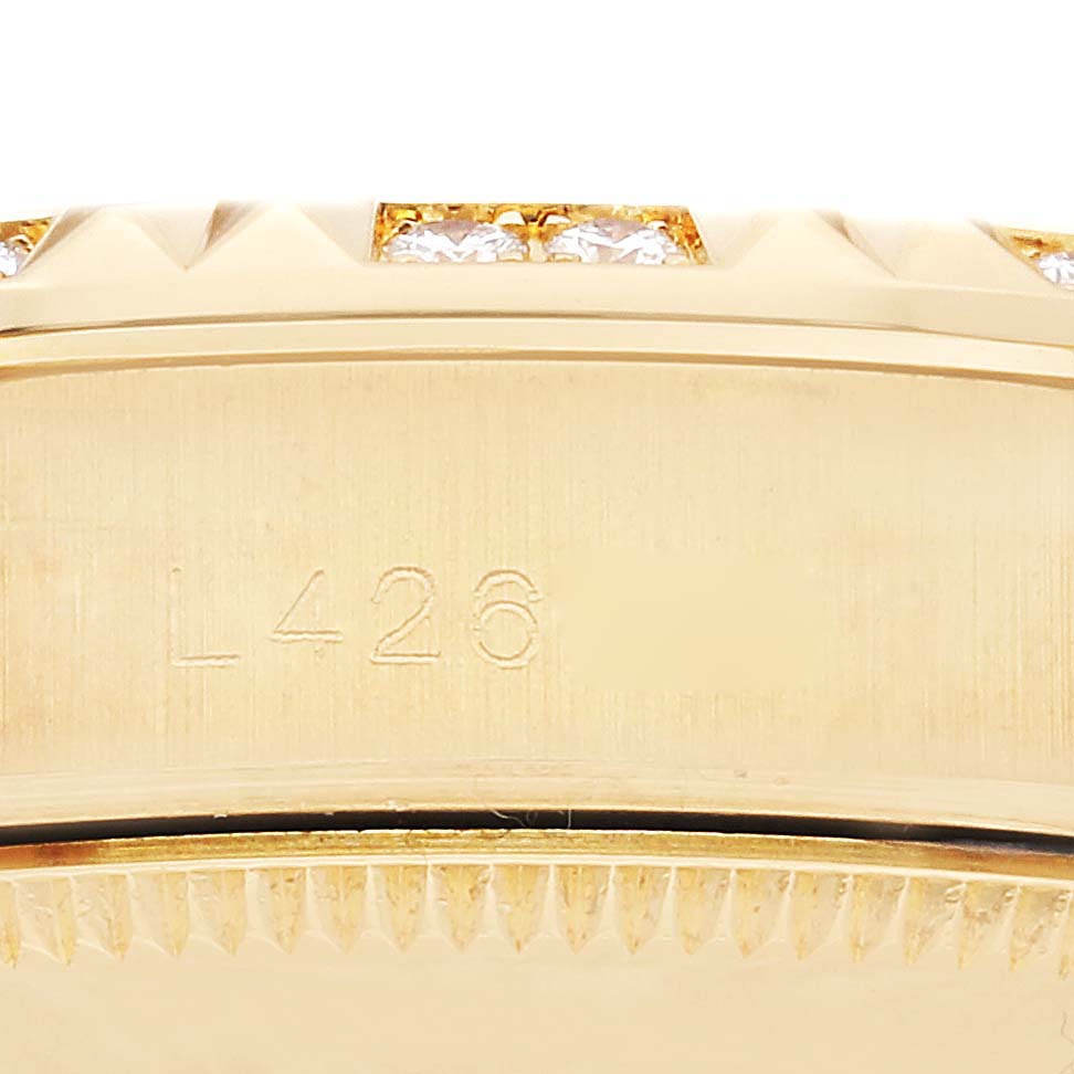 This close-up image shows a partial view of the bezel and case of the Rolex President 68258 Women's Yellow Gold Silver Dial 68258 Women's Yellow Gold Silver Dial model, with visible serial engraving.