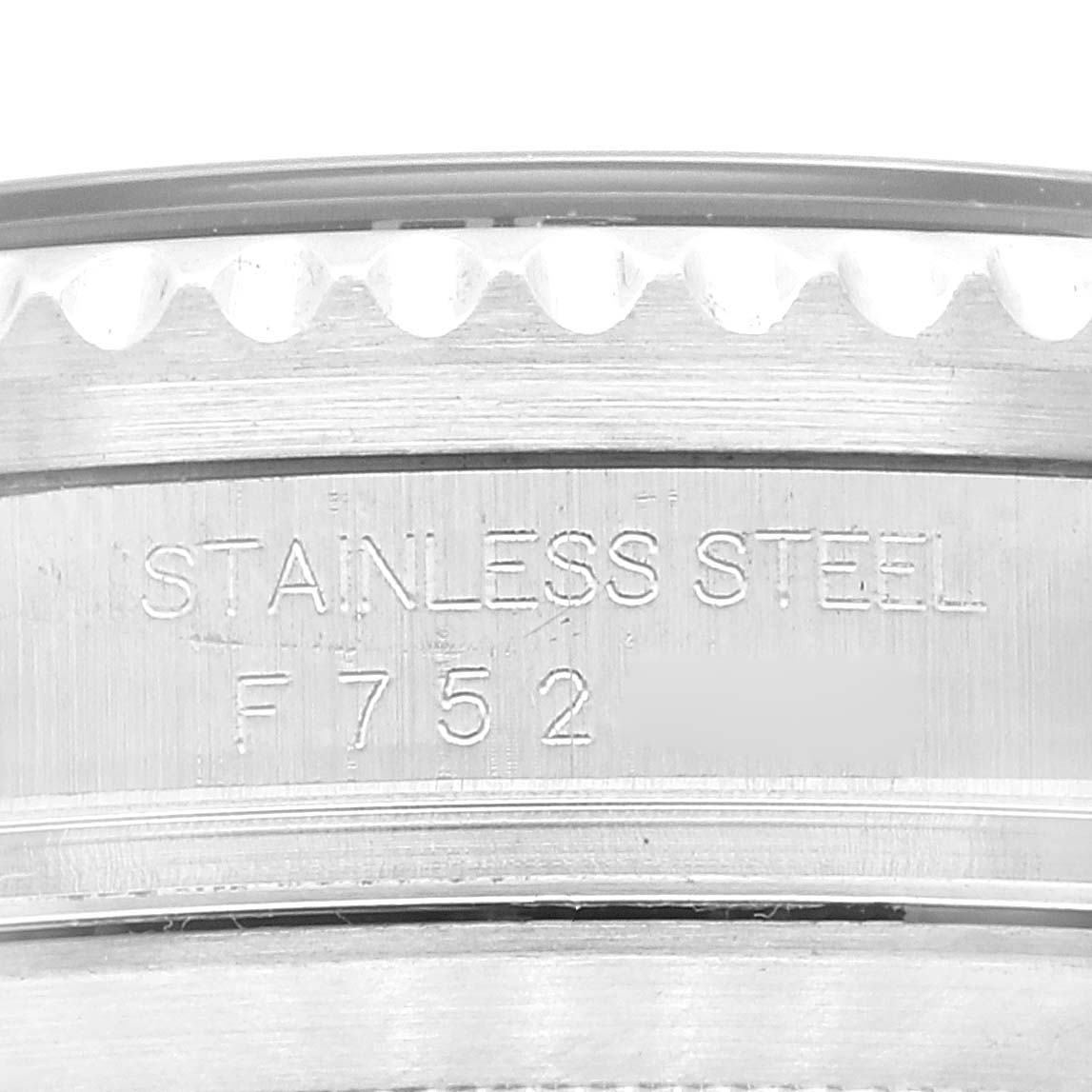 This image shows a close-up of the case side for the Rolex Sea-Dweller 16600 Men
s Stainless Steel Black Dial 16600 Men
s Stainless Steel Black Dial, focusing on the "Stainless Steel" engraving.