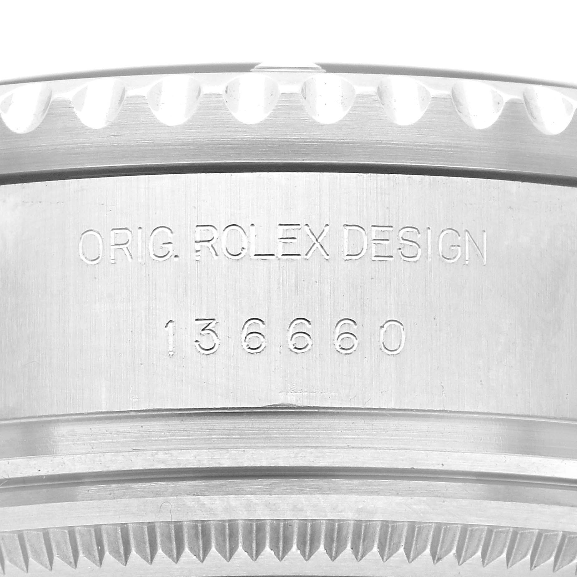 This is a close-up view of the edge and side of a Rolex Sea-Dweller 136660 Men
s Stainless Steel Black Dial 136660 Men
s Stainless Steel Black Dial watch, showing the engraved model number.