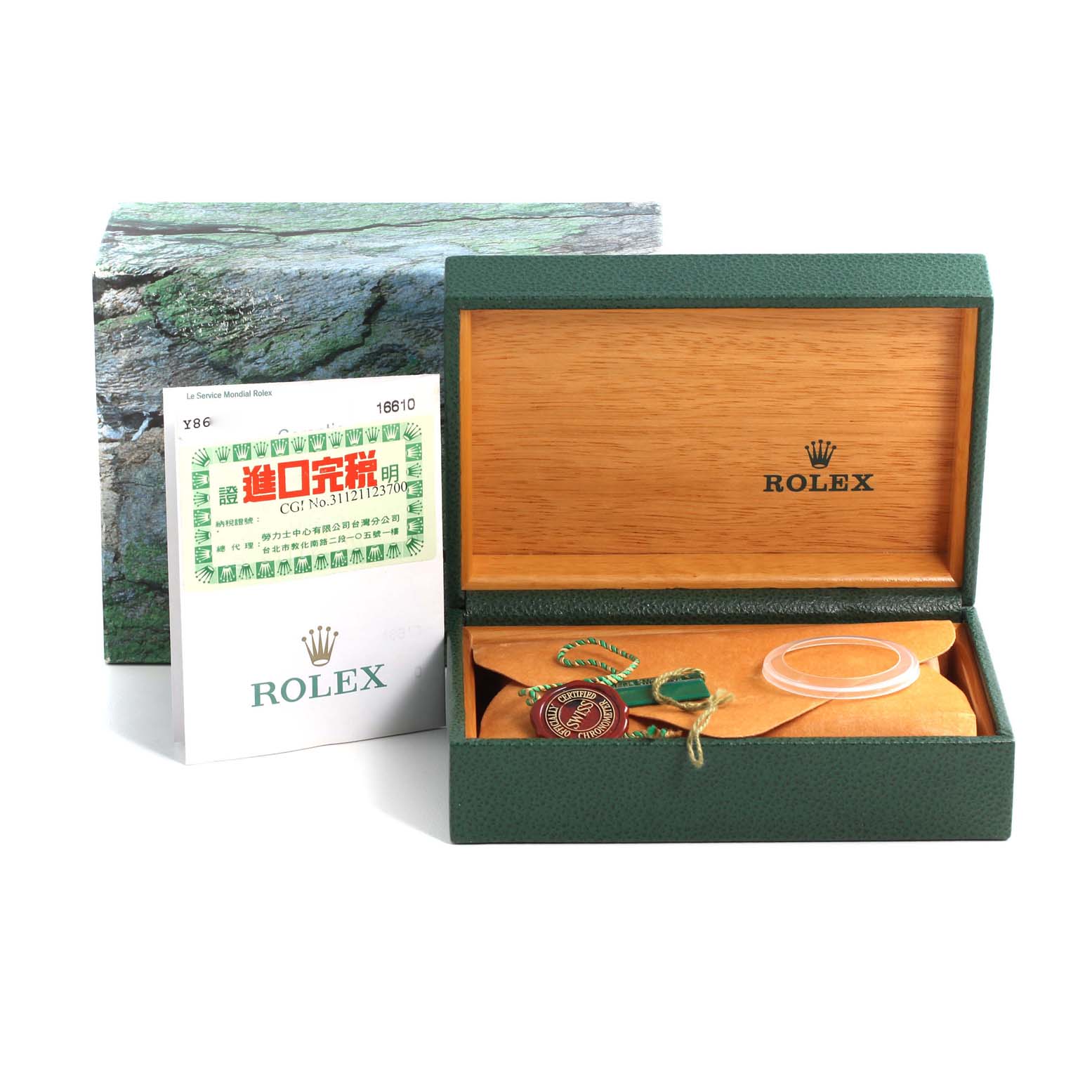 The image shows the box and accessories of a Rolex Submariner 16610 Men
s Stainless Steel Black Dial 16610 Men
s Stainless Steel Black Dial watch, including the warranty card and hang tags.