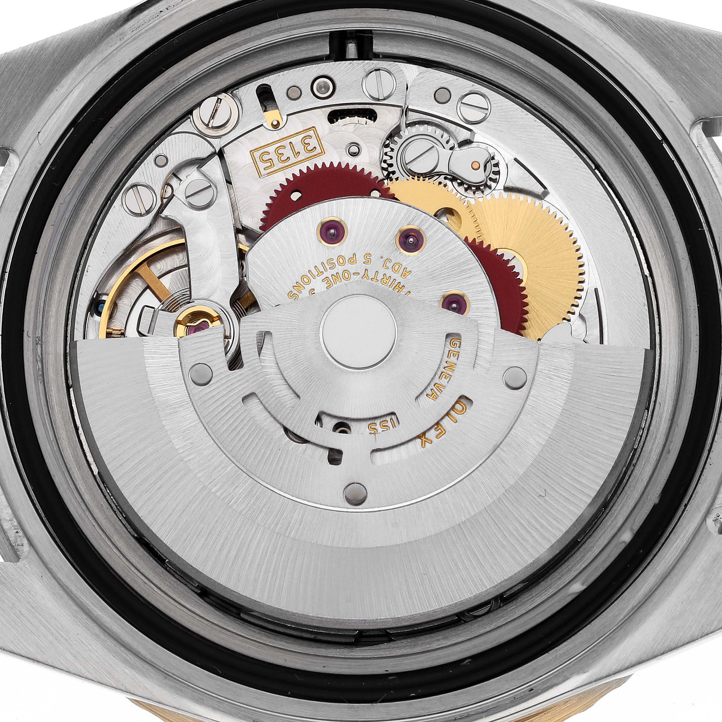 The image shows the internal mechanism, specifically the movement, of a Rolex Submariner 16613 Men's Steel and Gold (two tone) Blue Dial 16613 Men's Steel and Gold (two tone) Blue Dial watch viewed from the back.