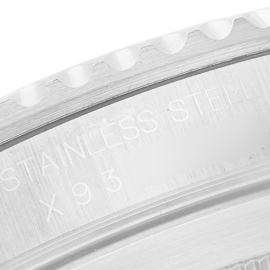 The image shows a close-up of the engraved case back edge of a Rolex Submariner 14060 Men
s Stainless Steel Black Dial 14060 Men
s Stainless Steel Black Dial, highlighting its stainless steel construction.