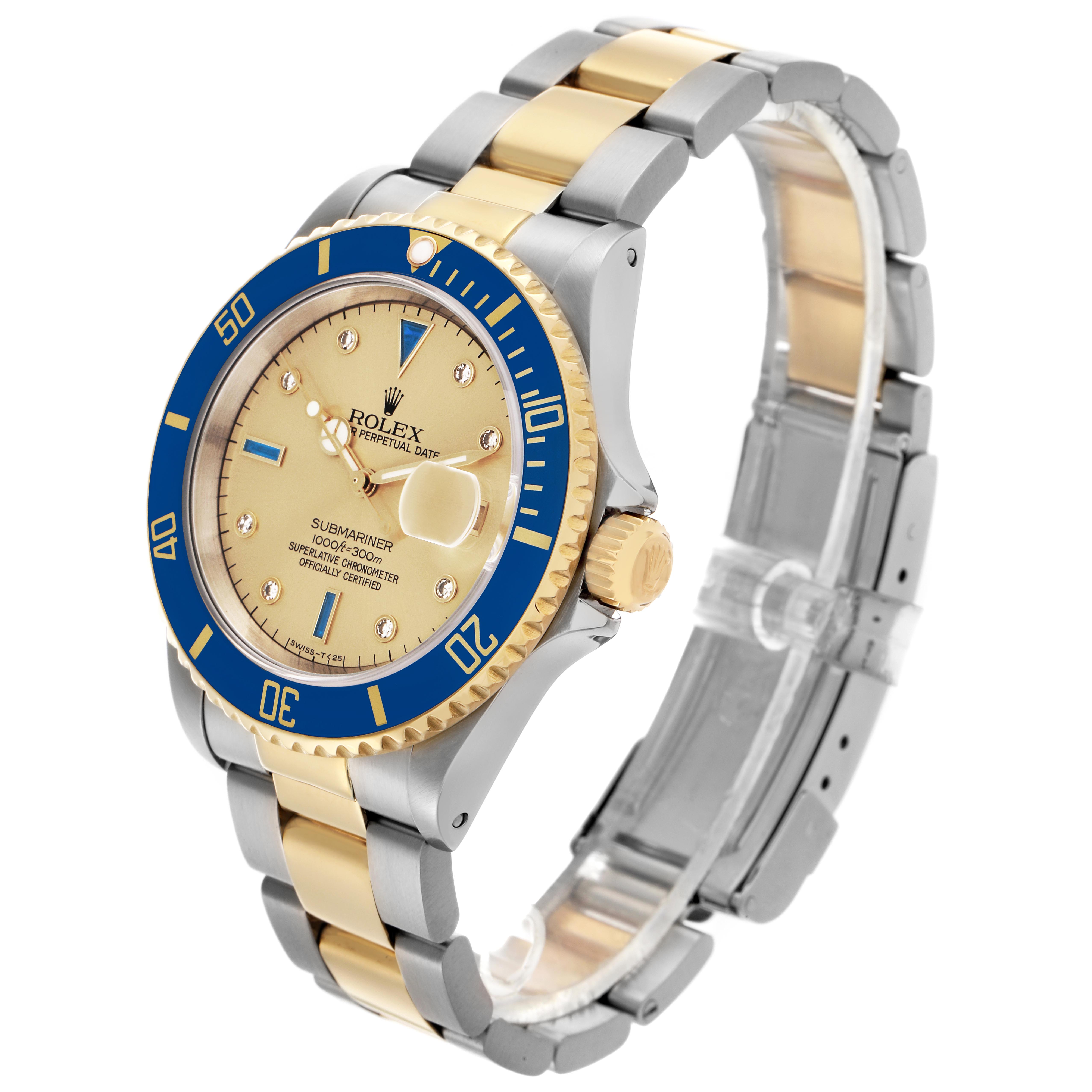The Rolex Submariner 16613 Men
s Steel and Gold (two tone) Champagne Dial 16613 Men
s Steel and Gold (two tone) Champagne Dial watch is shown at a three-quarter angle, highlighting the face, bezel, crown, and two-tone bracelet.