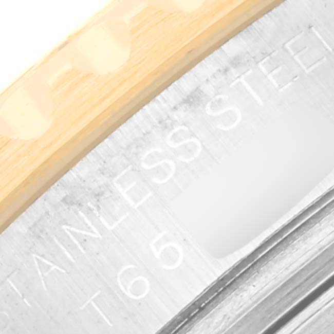 The image captures a close-up view of the bezel and part of the stainless steel case back of the Rolex Yacht-Master 69623 Women's Steel and Gold (two tone) White Dial 69623 Women's Steel and Gold (two tone) White Dial watch.