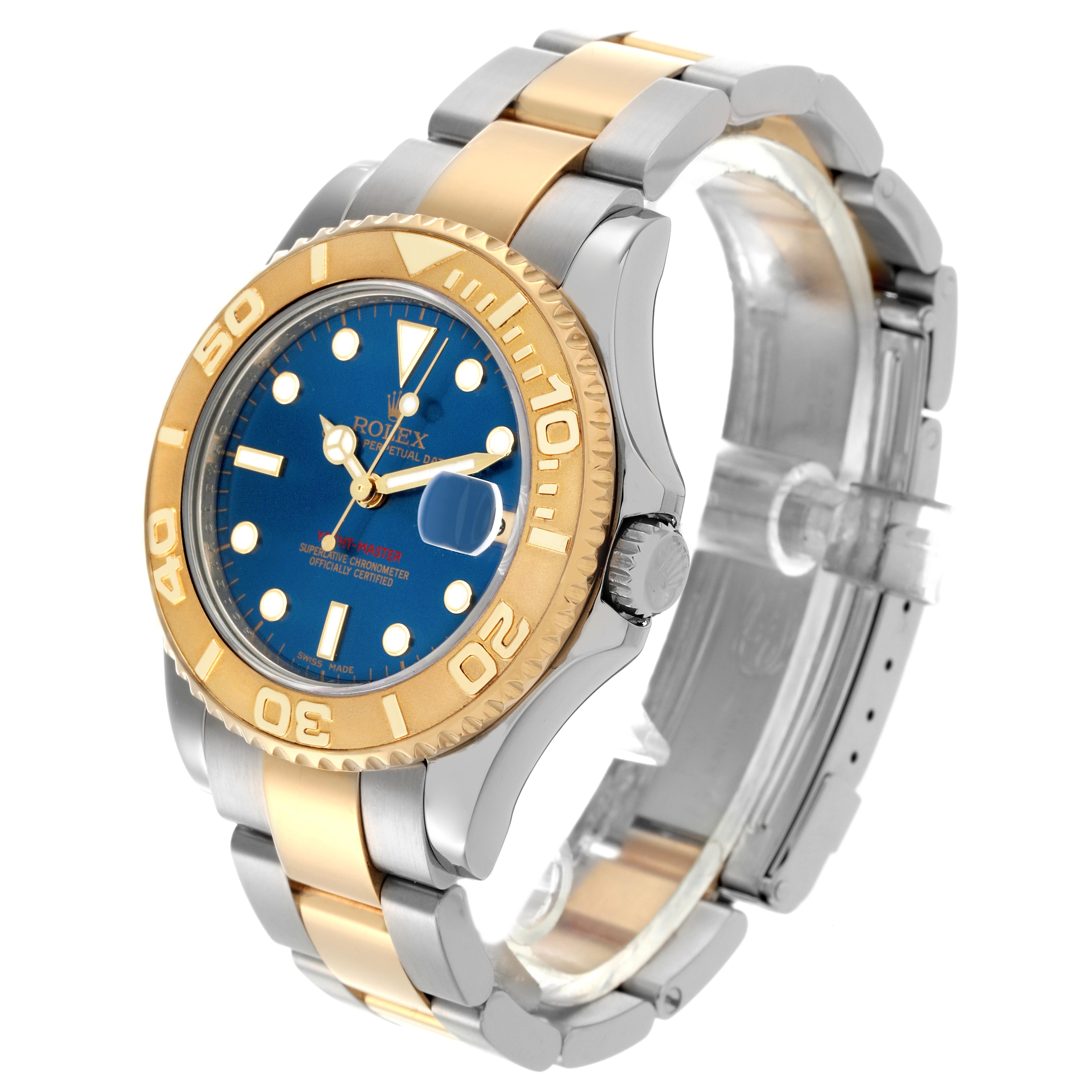 The Rolex Yacht-Master 168623 Men
s Steel and Gold (two tone) Blue Dial 168623 Men
s Steel and Gold (two tone) Blue Dial watch is shown at a three-quarter angle, highlighting the bezel, dial, crown, and bracelet.