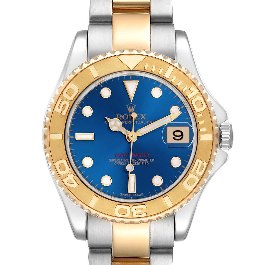The Rolex Yacht-Master watch is shown from the front, featuring a blue dial, gold bezel, and silver-gold bracelet.