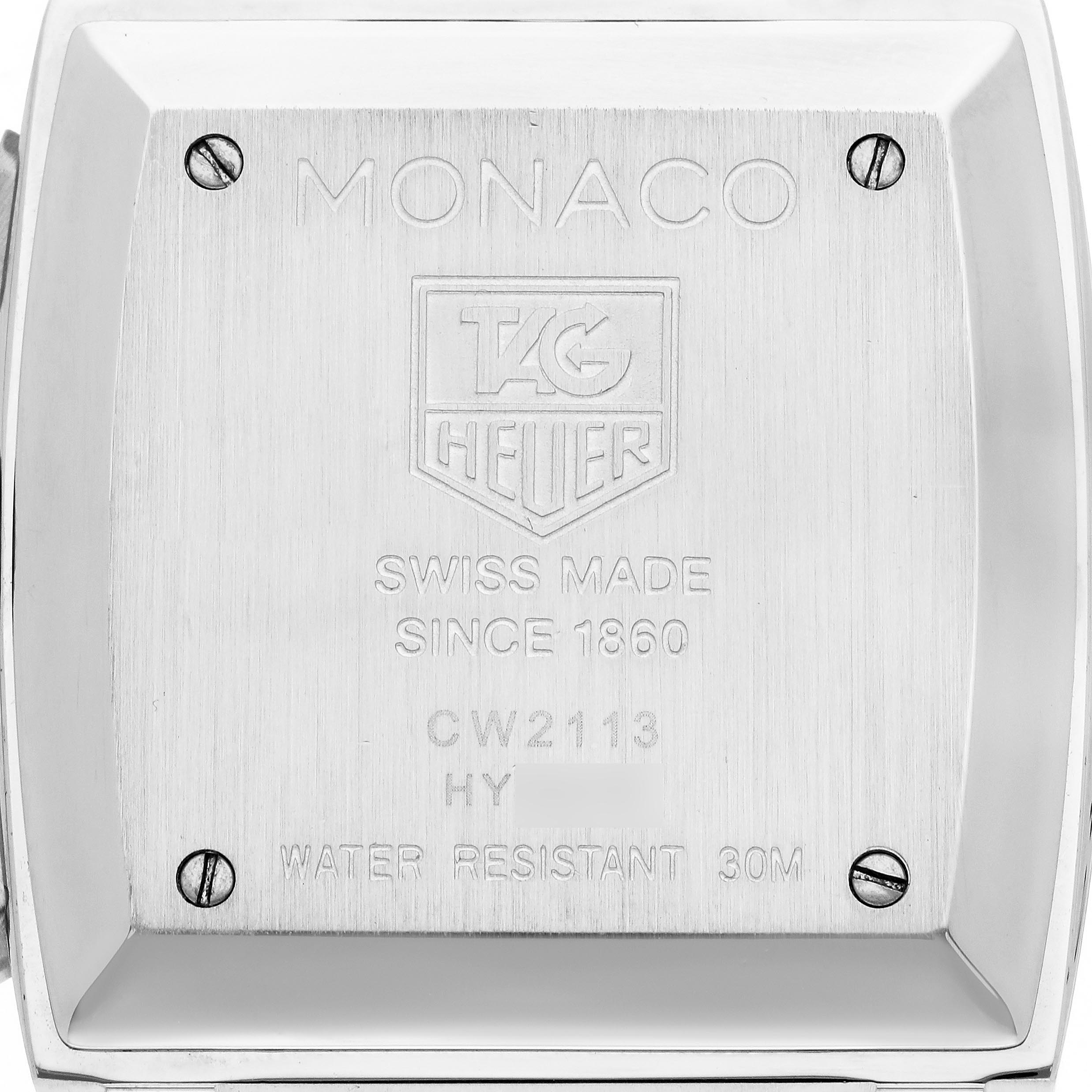 The image shows the case back of the Tag Heuer Monaco CW2113 Men
s Stainless Steel Blue Dial CW2113 Men
s Stainless Steel Blue Dial watch model, displaying engravings and four screws.