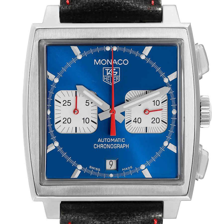 The image shows a front view of the Tag Heuer Monaco watch, featuring its square case, blue dial, and subdials.