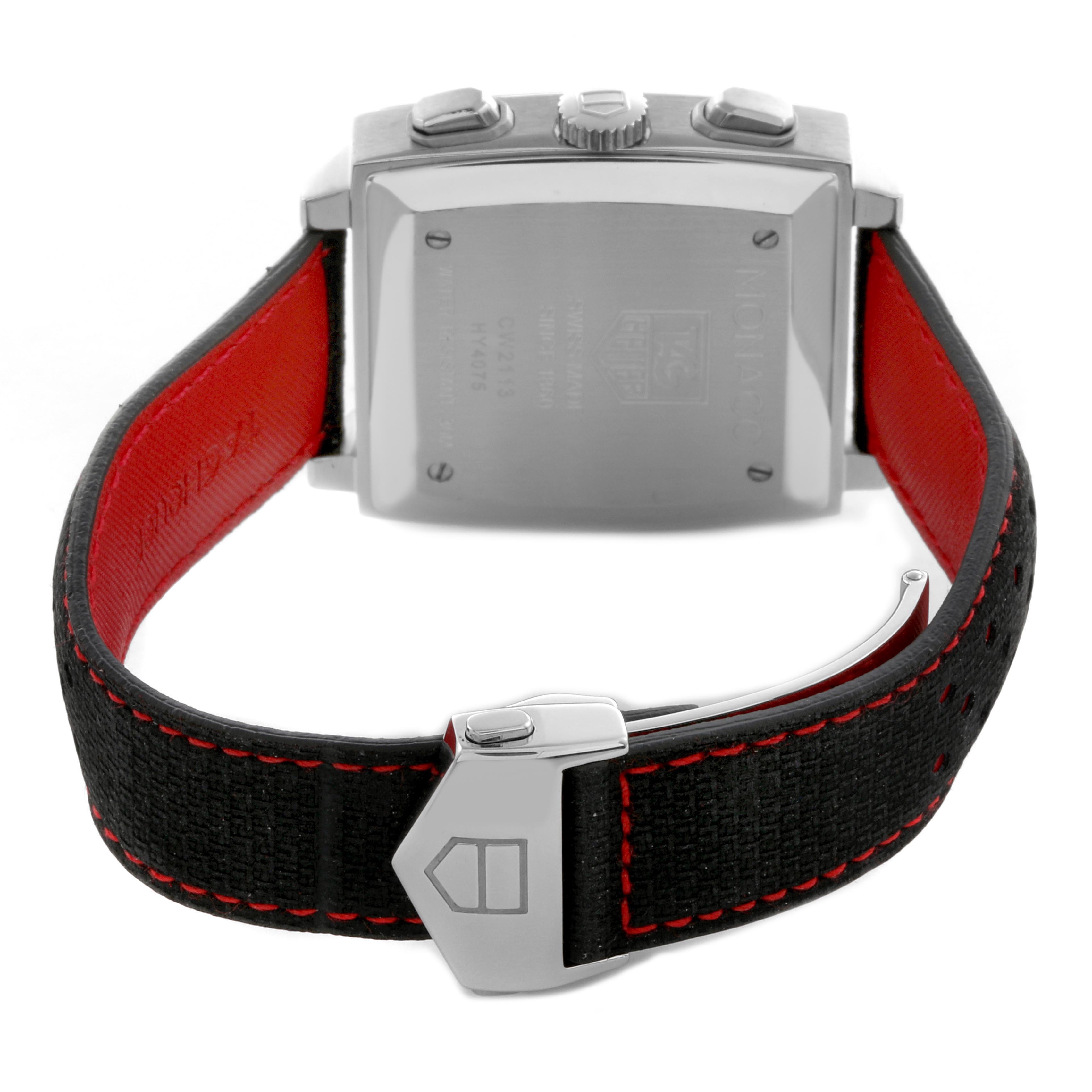 The image shows the back of the Tag Heuer Monaco CW2113 Men
s Stainless Steel Blue Dial CW2113 Men
s Stainless Steel Blue Dial watch with a focus on the clasp and strap, highlighting its stitching and color contrast.