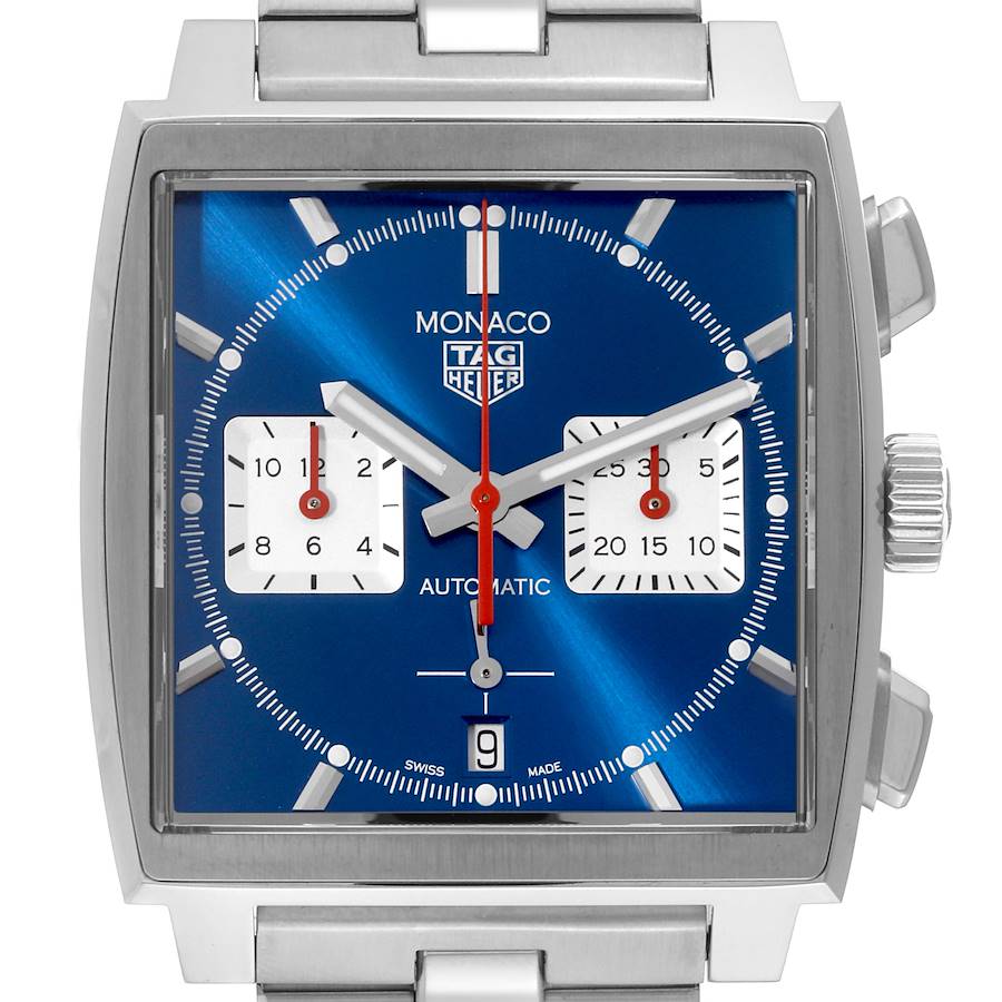 The image shows a front view of the Tag Heuer Monaco watch, displaying its blue dial, square case, and metal bracelet.