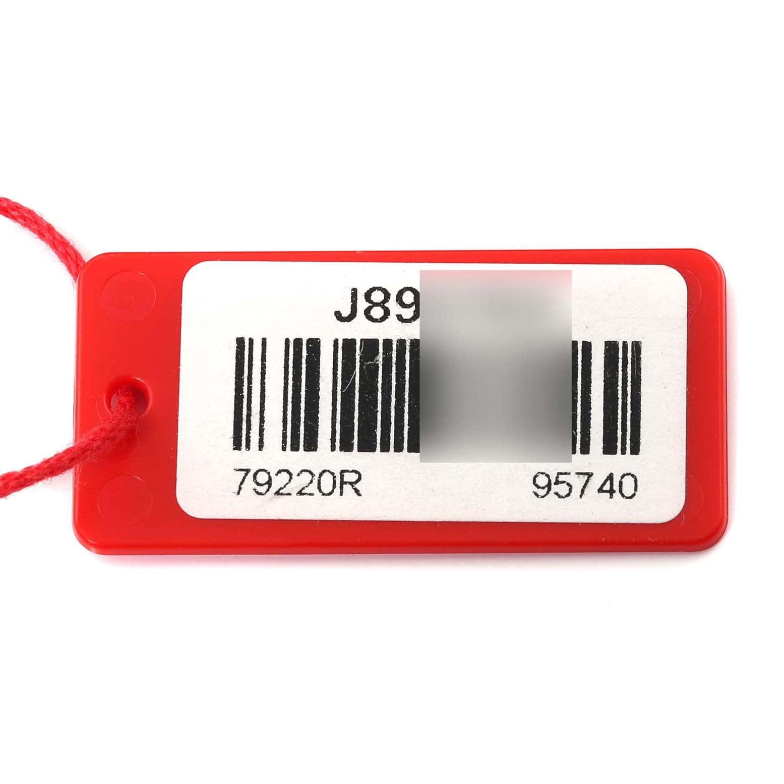 This image shows a red tag with a barcode and the model number '79220R' for the Tudor Heritage Black Bay 79220R Men's Stainless Steel Black Dial 79220R Men's Stainless Steel Black Dial watch.