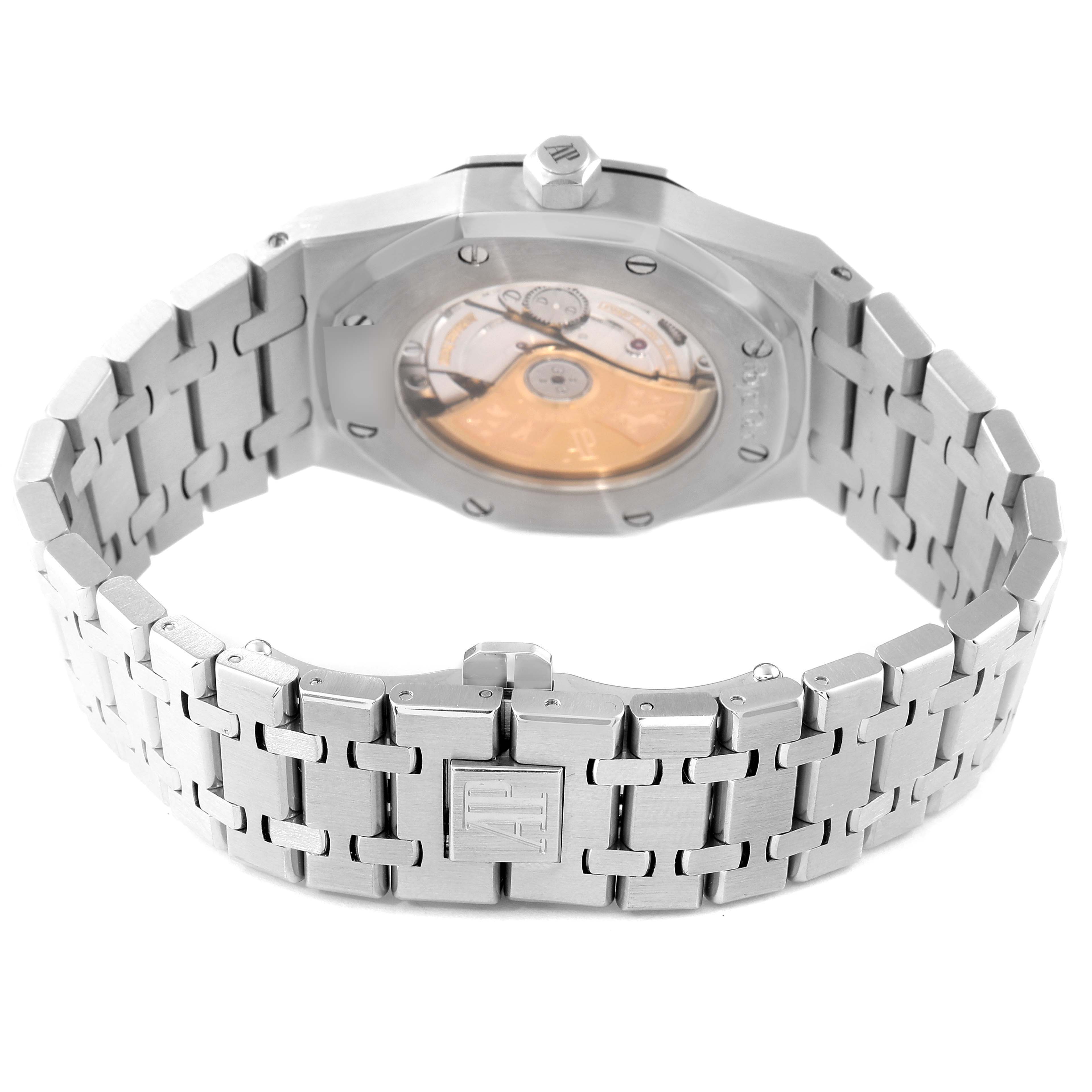 The image shows the backside of an Audemars Piguet Royal Oak 15300ST.OO.1220ST.03 Men's Stainless Steel Black Dial 15300ST.OO.1220ST.03 Men's Stainless Steel Black Dial watch, revealing its movement through a transparent case back and the metal bracelet.