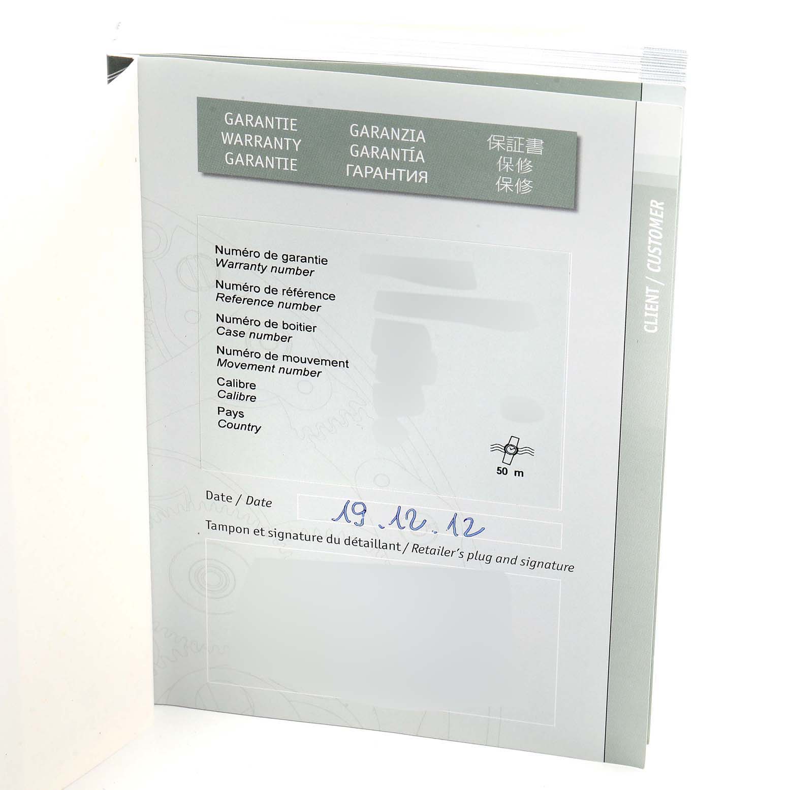 The image shows a warranty booklet for a Royal Oak model by Audemars Piguet from a slight angle, displaying various information fields.