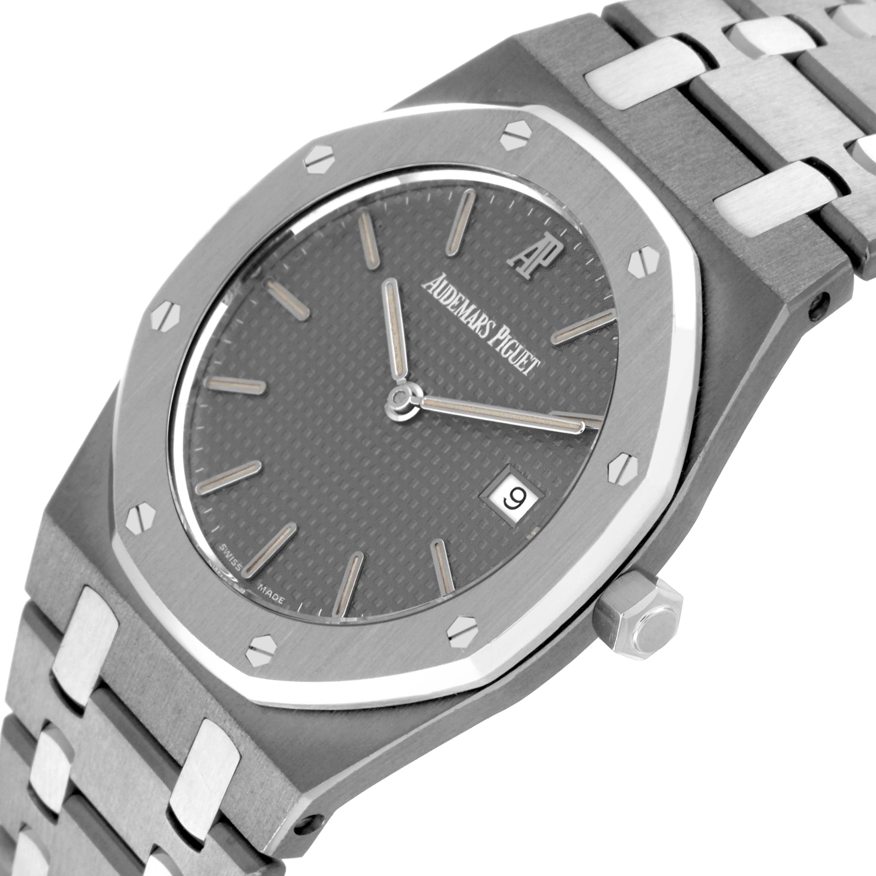 The image shows a close-up angle of the face and bracelet of a Royal Oak watch by Audemars Piguet, highlighting its dial and date window.