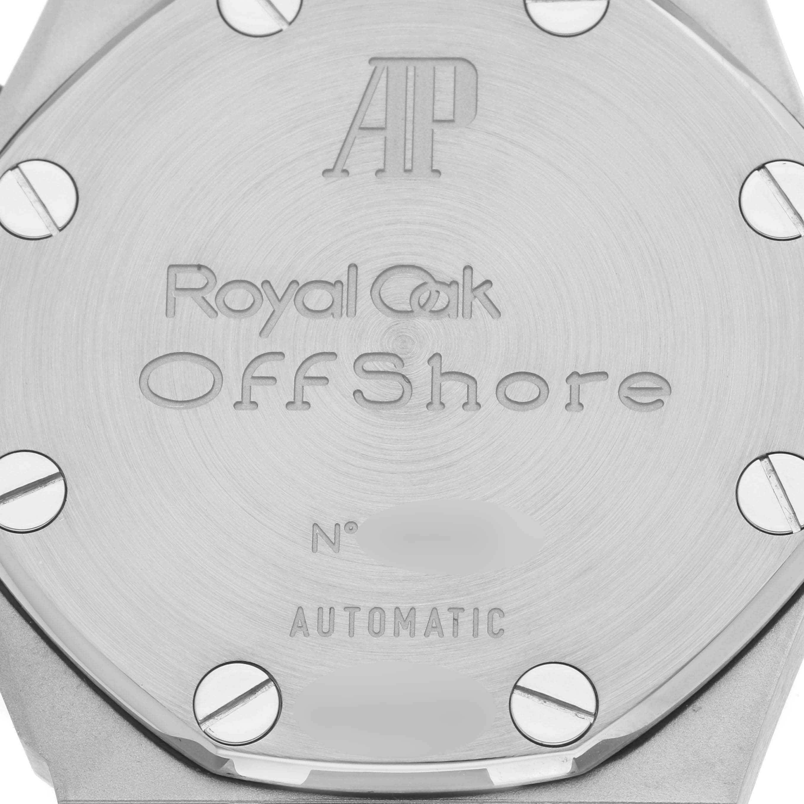 The image shows the back case of a Royal Oak Offshore model by Audemars Piguet with engraved details and screws.