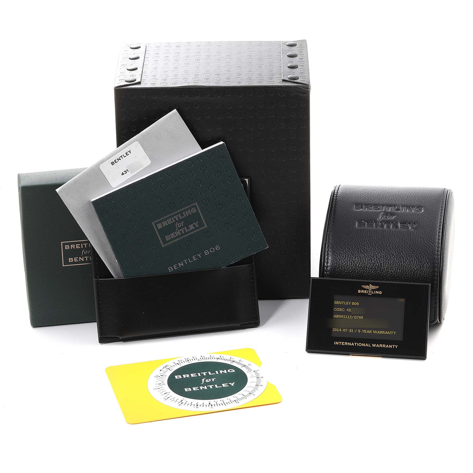 The image shows a Bentley watch by Breitling with its box, manuals, warranty card, and other accessories placed at different angles.