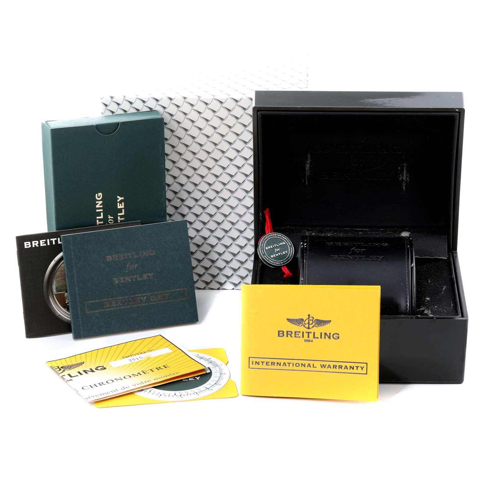 The image shows the packaging and accessories of a Bentley model by Breitling, including a box, documents, and warranty cards.