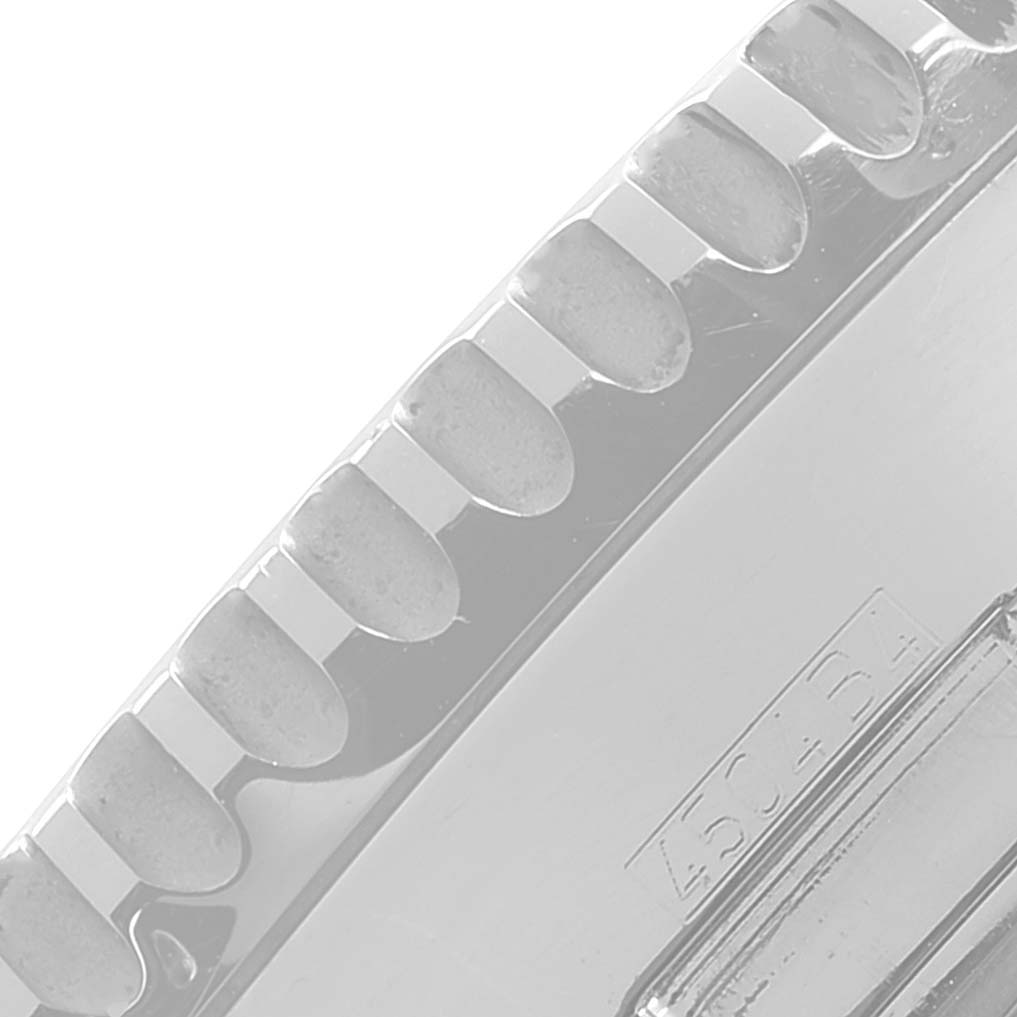 The image shows a close-up view of the bezel and part of the case for a Breitling Navitimer A24322 Men's Stainless Steel Silver Dial A24322 Men's Stainless Steel Silver Dial watch.