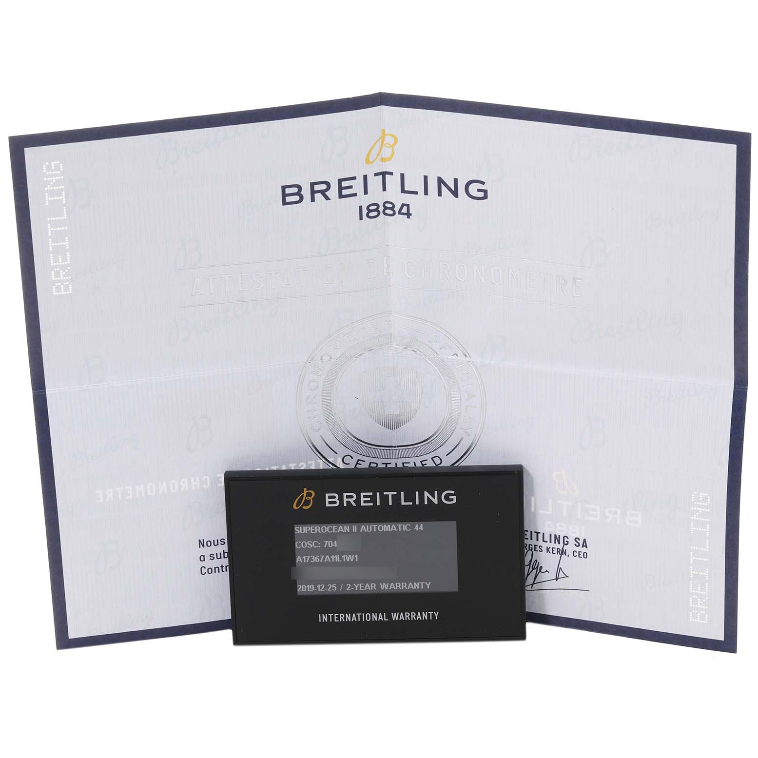 Displayed are the international warranty card and certificate booklet for a Breitling Superocean A17367A11L1W1 Men's Stainless Steel Green Dial A17367A11L1W1 Men's Stainless Steel Green Dial watch.