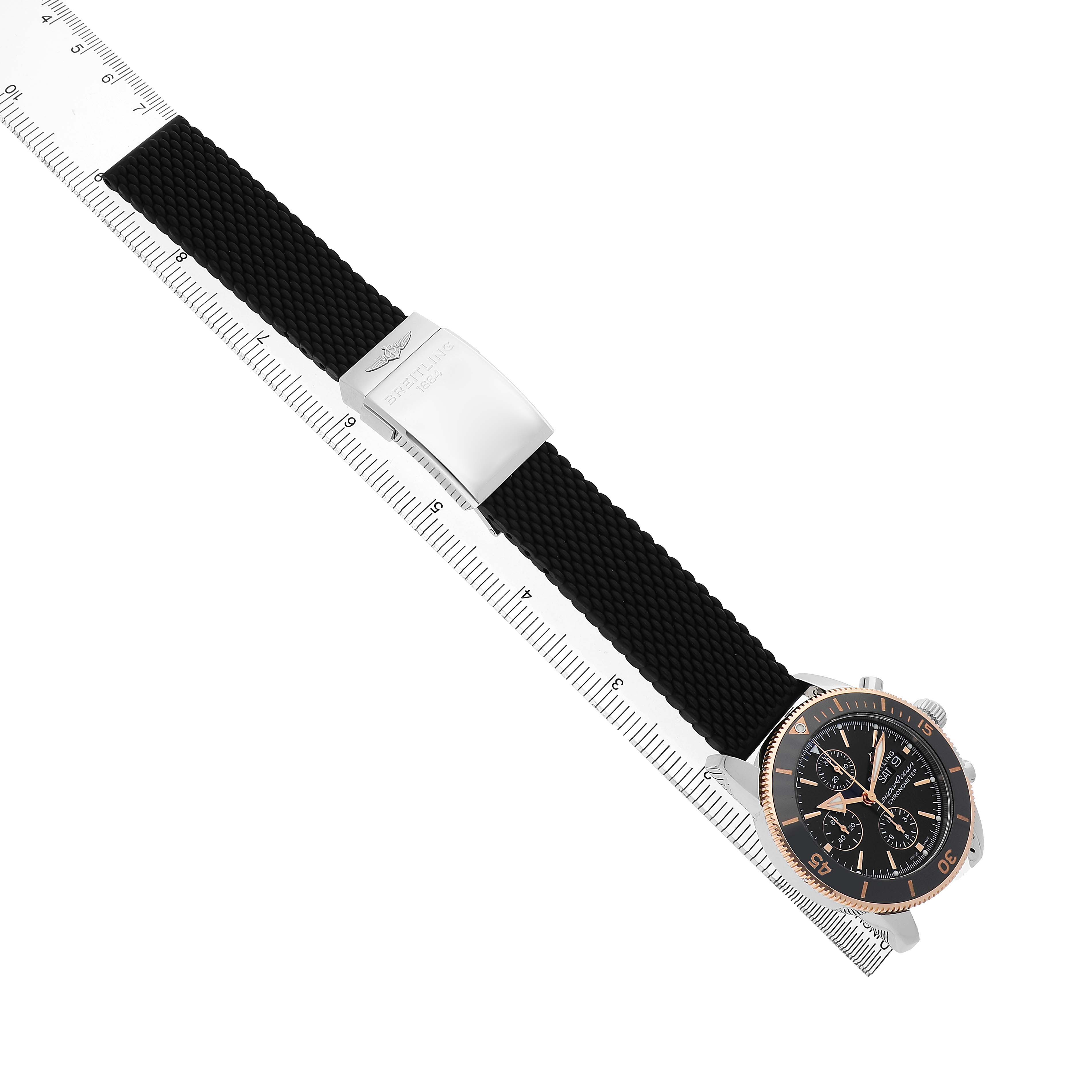 The Breitling Superocean U13313 Men's Stainless Steel Black Dial watch is shown at a diagonal angle, featuring the black dial, bezel, and textured strap with clasp.